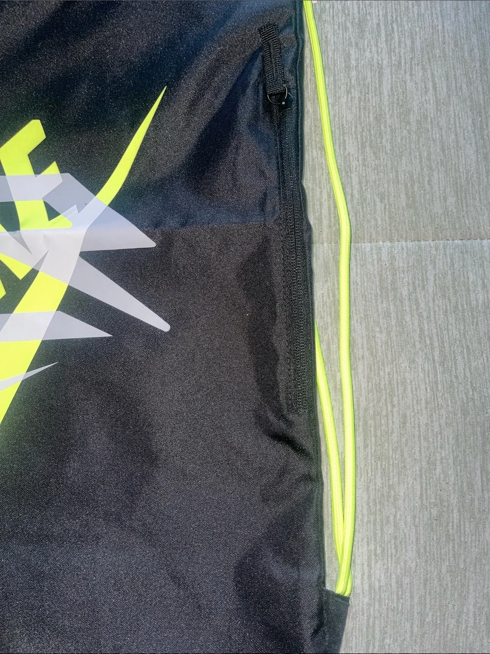 Nike Black Drawstring Backpack with Neon Yellow Logo
